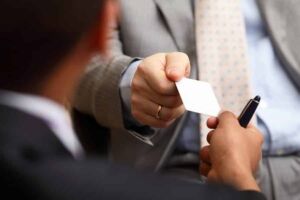 A man holding Business Cards
