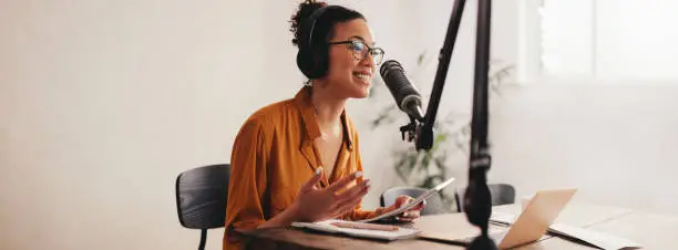 A woman hosting a podcast